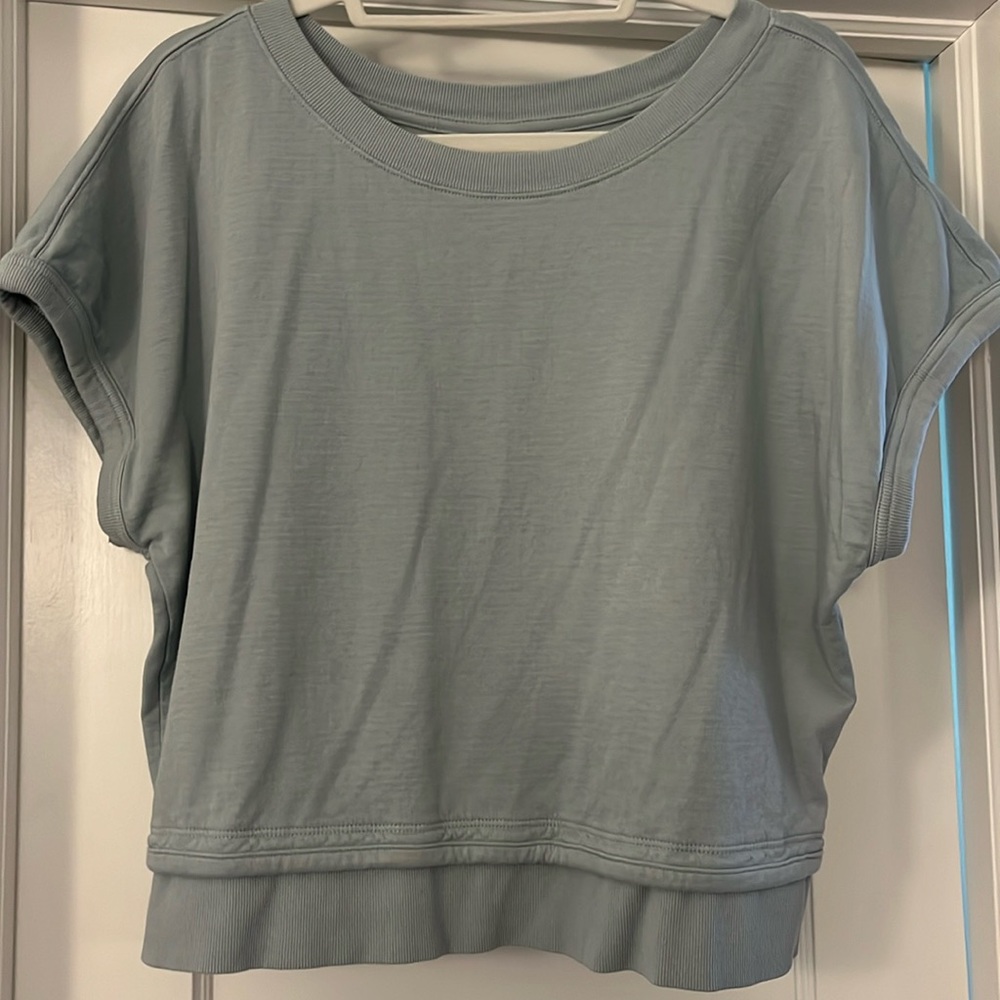 Athleta slightly oversized short sleeve sweatshirt in size XS and light blue.
